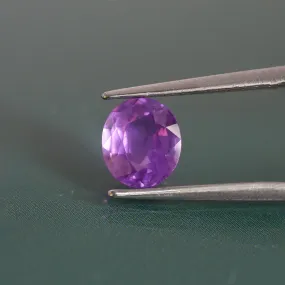 Sapphire opalescent | natural, pinkish purple, oval cut 6.6x5.8 mm, 1.1ct